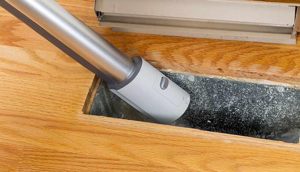 Cleaning Inside Heating Floor Vent With Vacuum Cleaner